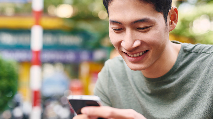 Smiling man with cell phone