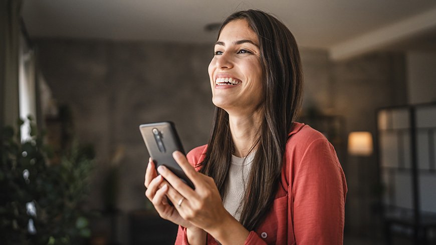 woman holds mobile phone