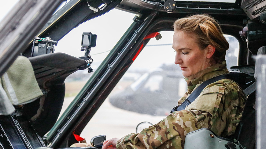 Female military pilot prepares for flight